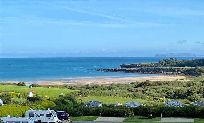 Spacious all-weather serviced pitches for tents, touring caravans, campervans and motorhomes with stunning sea-views of Lligwy Bay on Anglesey.